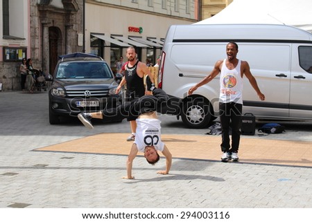 INNSBRUCK, AUSTRIA - JUNE 26: Street dancers are performing on Maria Theresien Street on June 26, 2015 in Innsbruck.