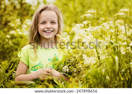 Girl with flowers smiling