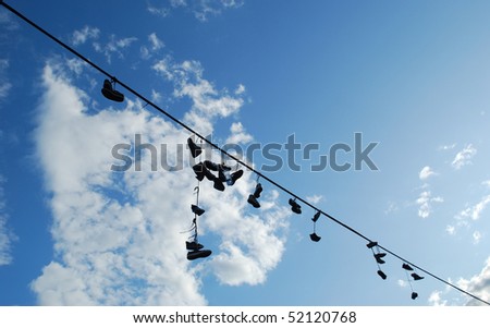 old boots hanging on the rope
