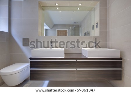 Modern Bathroom Detail With Twin Sinks. Built-In Cupboard And ...