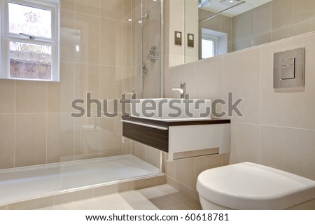 Stylish modern bathroon suite with basin, cabinet, wc and shower cubicle