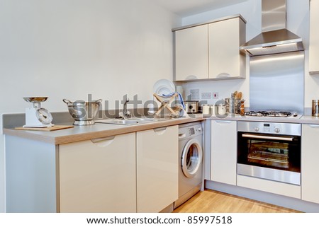 Modern kitchen interior with fitted units and appliances