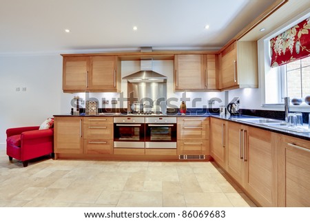 Luxury modern fitted kitchen with built in appliances and granite worktop