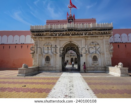 DESHNOKE, INDIA - NOVEMBER 25, 2013: Unidentified people in front of Karni Mata Temple at Deshnoke, India. Temple is famous for the approximately 20,000 holy black rats called kabbas.