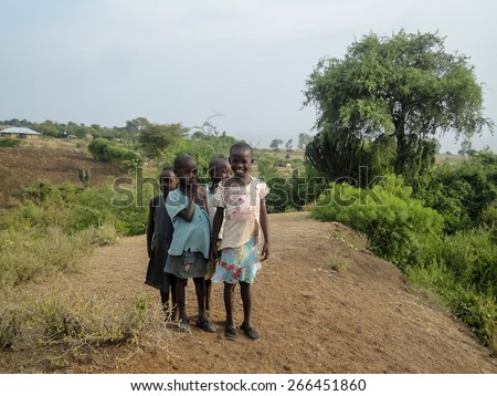 RONGO, KENYA - FEBRUARY 15, 2014: Unidentified children on the farm in Rongo, Kenya. Tongo is small agricultural town in South Nyanza District in Kenya.