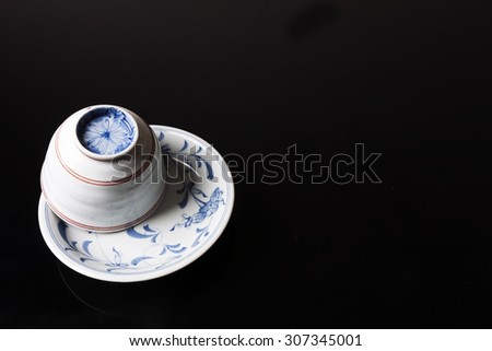 Traditional Japanese cup on black background
