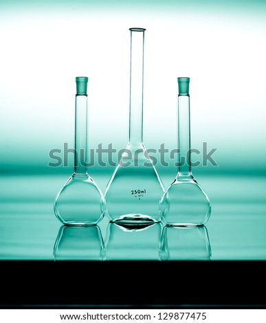 Glass flasks in a chemical laboratory. Scientific biochemistry equipment for science experiments and research. Chemistry glassware for the pharmaceutical industry.