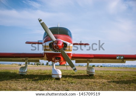 Landscape with aircraft. Propeller, wings and fuselage of the airplane at the airfield. Small aviation - air transport for travel on the sky.