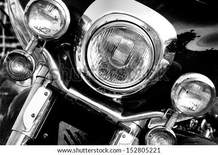 Vintage motorbike. Retro motorcycle with headlights on black and white colors.