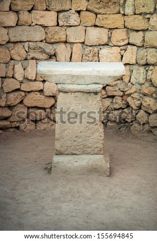 Marble ancient altar in the old temple. Stone altar for performing rituals in ancient religion.