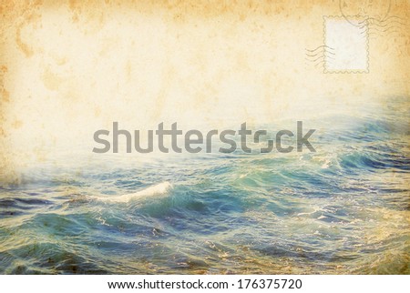 Vintage summer postcard with sea water and post stamps. Travel concept in retro style about sea vacation. Scrapbooking style with old paper texture and sea waves background.