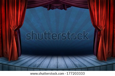 Theater stage with red curtains and spotlights. Theatrical scene in the light of searchlights, the interior of the old theater.