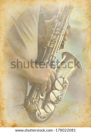 Jazzmen playing the saxophone. Jazz musician with your musical instrument on grunge texture background. Grunge musical background with old page and a saxophone.