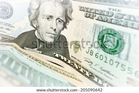 Dollar Bills closeup with soft focus. Closeup of Andrew Jackson\'s portrait on a US twenty dollar banknote.