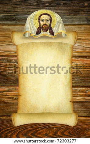 Manuscript for a prayer or an old form to the sacred text in the old Russian style with a Christian image of Jesus Christ. Vintage background on the brown wooden texture. Dark old parchment blank.