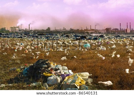 Debris dump and the mountain of garbage - ecology concept about mud and human activity. Environmental pollution from industrial  smoking and chimneys factories. Industrial destruction from the city.