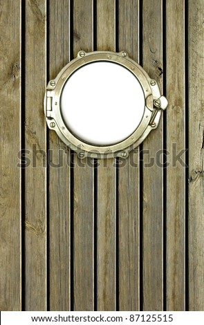 Porthole on the wooden background at pirate ship. Ship porthole as a circle frame, isolated on white.  Ship window on the old nautical vessel.