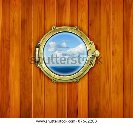 Ship porthole window with seascape ocean. Brass porthole at the old sailing vessel.