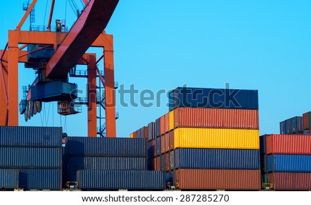 Sea port, cargo ships and container yard - industrial structure for import and export of freight. Shipping and logistic terminal of the global business.