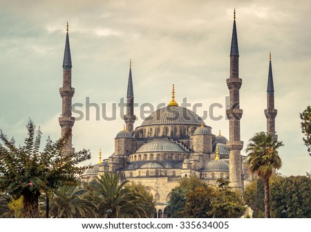Blue mosque in Istanbul - famous landmark of islam architecture in Turkey. Four minarets of ancient mosque at cloudy sky, ottoman architecture style.