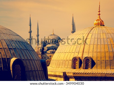 Blue Mosque with minarets - view from Hagia Sophia dome of Istanbul. Blue mosque in Istanbul in golden sunset light - famous landmark of islam architecture in Turkey.