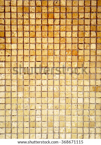 Mosaic tile background. Mosaic wall in antique style. Background tiles with golden colors for your design.
