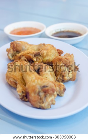 Fried chicken is a dish consisting of chicken pieces usually from broiler chickens which have been floured or battered and then pan-fried, deep fried, or pressure fried.