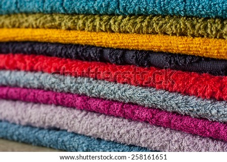 Items. A stack of towels. Front plan with depth of field. Without the use of filters.