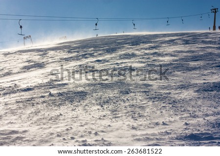 Landscape, sports. Empty slopes and lifts. Very strong wind. Winter Sports Carpathians. Ukraine.