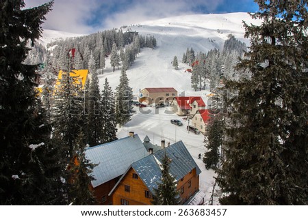 Landscape, sports. View of the mountains from the slopes and top hotels. Sunny with clouds. Carpathian Mountains. Ukraine.