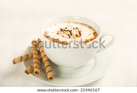 Rich hot chocolate with whipped cream, chocolate, caramel, and cinnamon. Served with cookies.