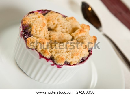 Single Serving blueberry cobbler in white ramekin