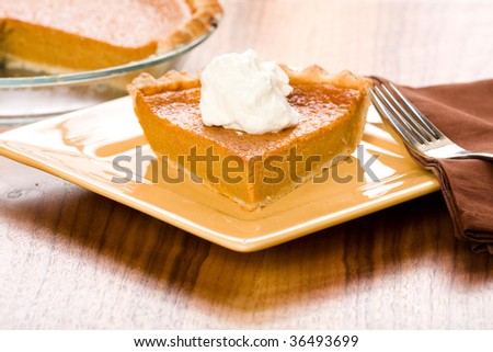 Sweet Potato Pie with a dollop of freshly whipped cream