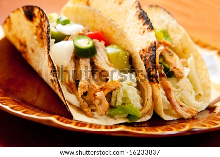 shredded chicken tight accompany cabbage and a chunky salsa verde