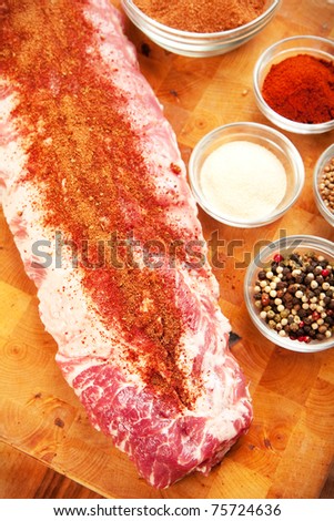 Baby back rib presented with common spices used for rub seasoning