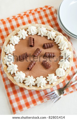 Light and chocolatey French Silk Pie with plenty of whipped cream and chocolate curls