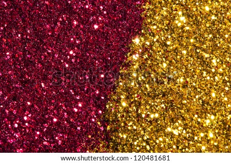 Holiday yellow and red shiny background. Shiny particles in yellow and red colors