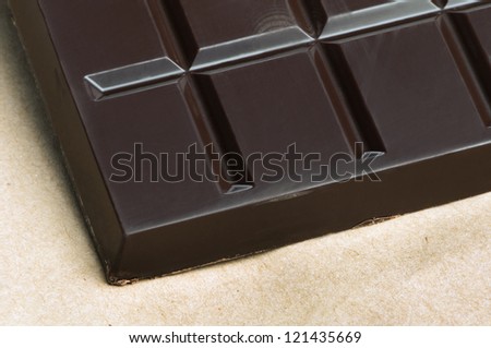 Chocolate bar in packaging of paper bag.