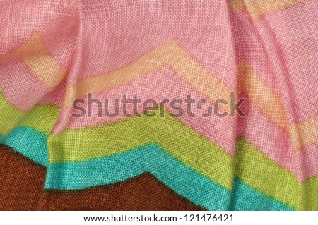 Stamped multicolored lines fabric. Natural linen fabric.Pink, brown, green and beige clors.