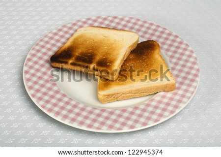Toasted bread in a pink checkered plate