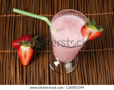 Strawberries milk shake and fresh fruit strawberry. Cocktail with milk.