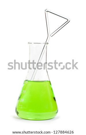 Laboratory beakers filled with green color liquid substances