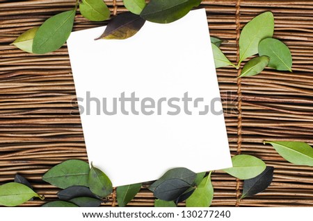Wooden background and leafs. Border of leafs and copy space