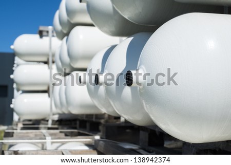 White industrial butan bottles.Compressed natural gas