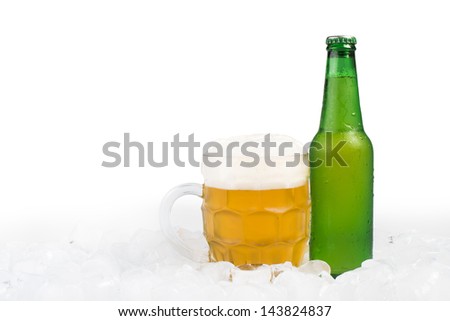 Green bottle of beer and beer mug. White isolated studio shot.