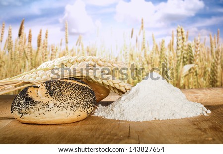 Bread, flour and wheat cereal crops. Cereal crops on the background