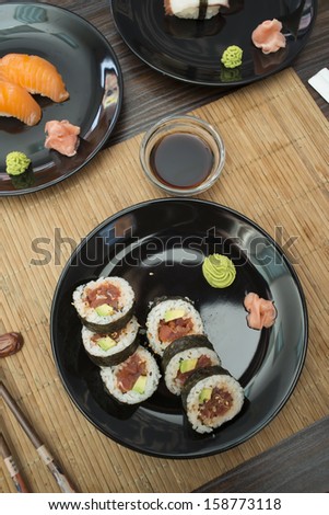 Sushi in sushi bar. Table and ration sushi