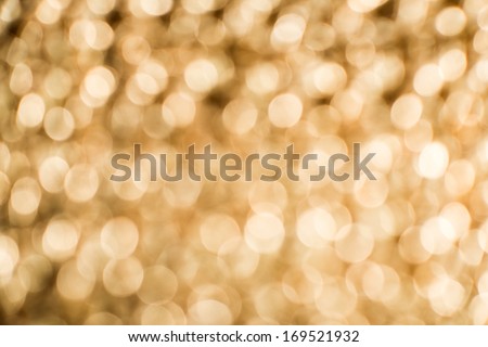 Gold color shiny ornaments bokeh. Blurred background