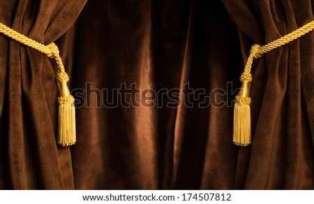 Brown theatre curtain and yellow tassels