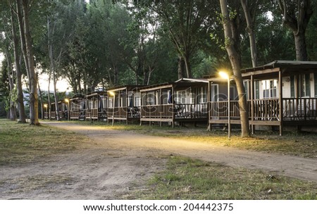 Wooden bungalow in camping at night